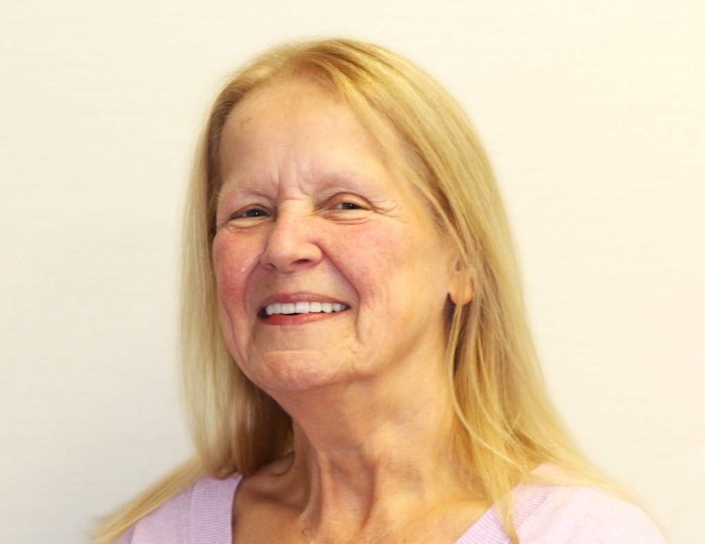 Portrait of a satisfied dental patient sharing her treatment experience